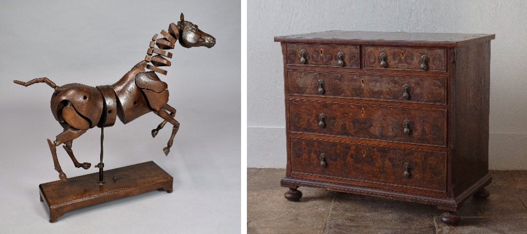 Folk art horse sculpture constructed from metal components displayed alongside an antique wooden chest of drawers with original hardware, showcasing sculptural and practical objects at The Decorative Fair.