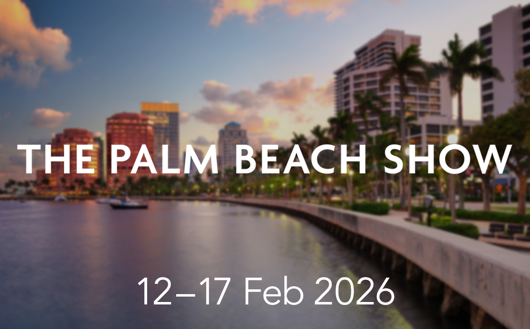 Palm Beach waterfront skyline at sunset with palm trees and waterfront promenade, representing the setting for The Palm Beach Show, February 12–17, 2026.