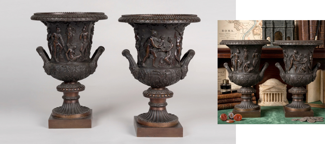 Pair of classical bronze urns with sculptural relief detailing displayed beside antique books and architectural objects — highlighting the enduring appeal of craftsmanship, provenance, and historical texture in an increasingly digital world.
