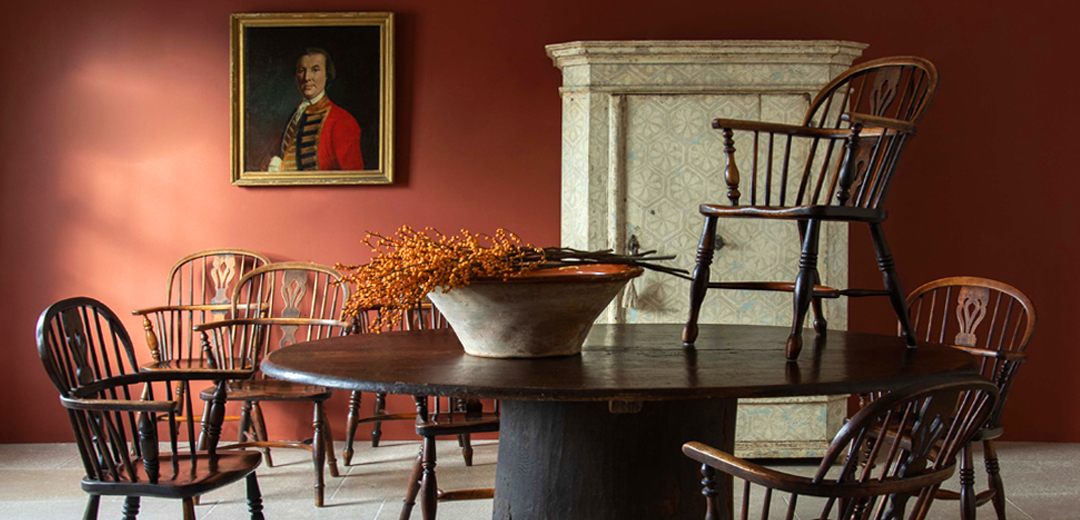Collection of antique Windsor chairs and period furniture, highlighting the unique inventory that requires specialized documentation and management.