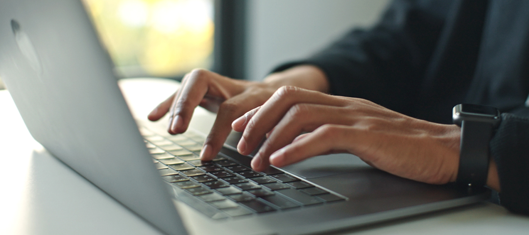 Dealer using digital inventory management software to organize one-of-a-kind antiques and prepare inventory for online discovery and sale.