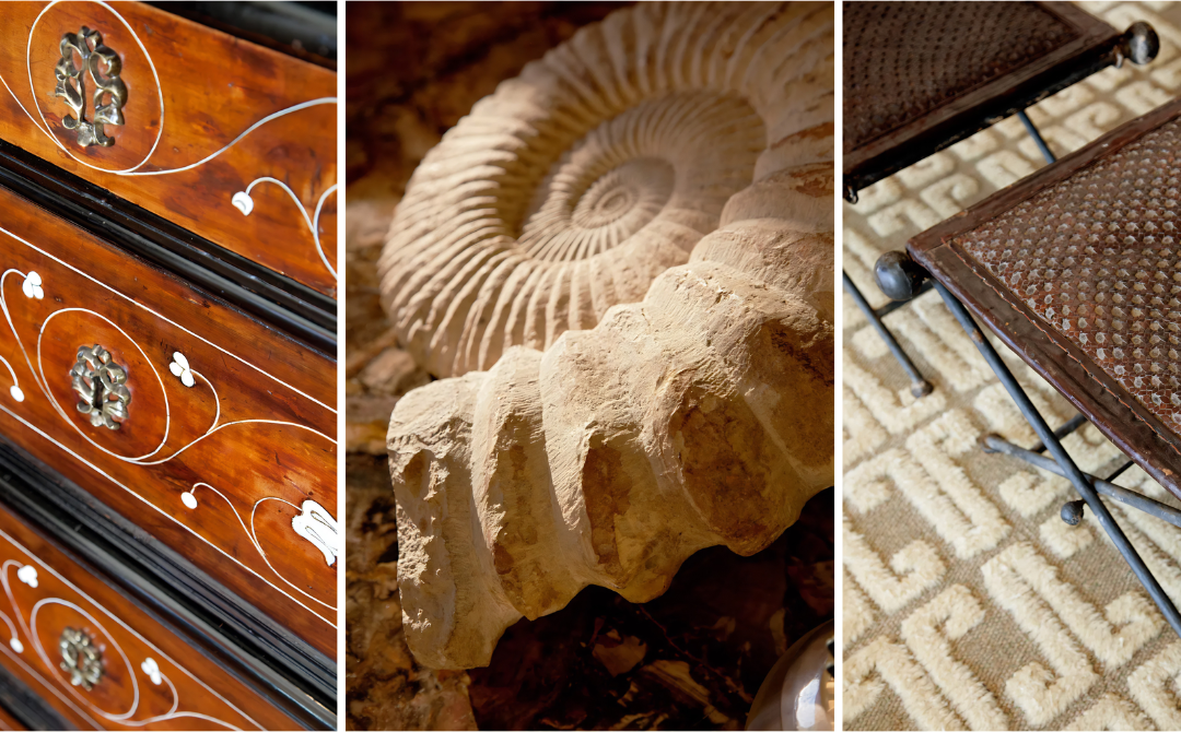 Three close-up details of antique inventory: an inlaid commode with pierced silver mounts, a carved stone ammonite, and iron tables on a Greek key rug. Room details from Tucker and Marks.