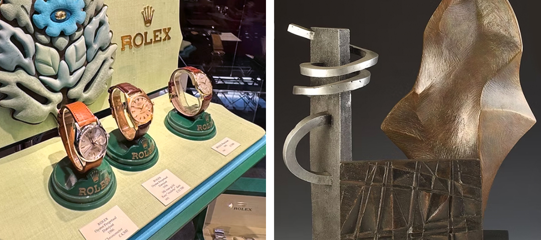Vintage Rolex watches displayed alongside a modern abstract bronze sculpture at an antiques fair booth